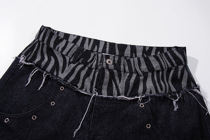 Close-up of the zebra double-waist detail on baggy jeans