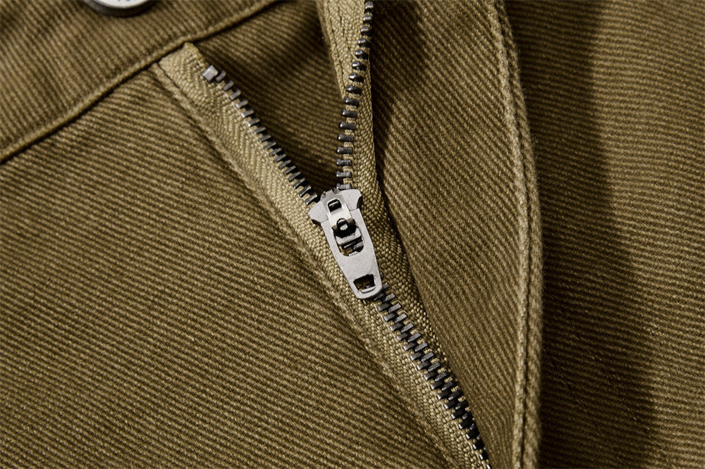 Detailed view of pocket and panel construction on cargo trousers