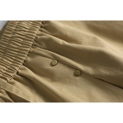 Close-up of fabric and studs on relaxed-fit shorts
