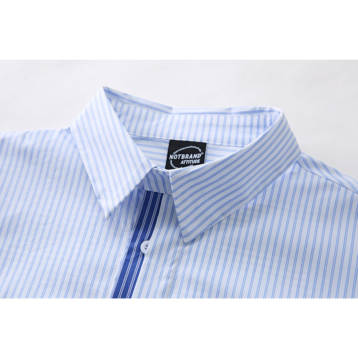 Close-up of cuff detail on relaxed fit striped shirt