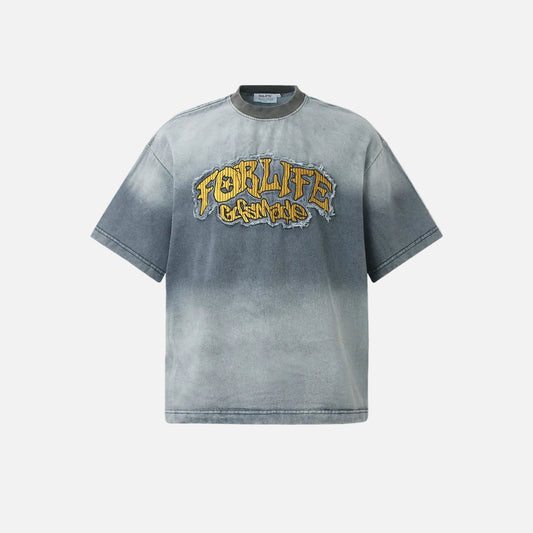 Front view of faded denim appliqué oversized T-shirt