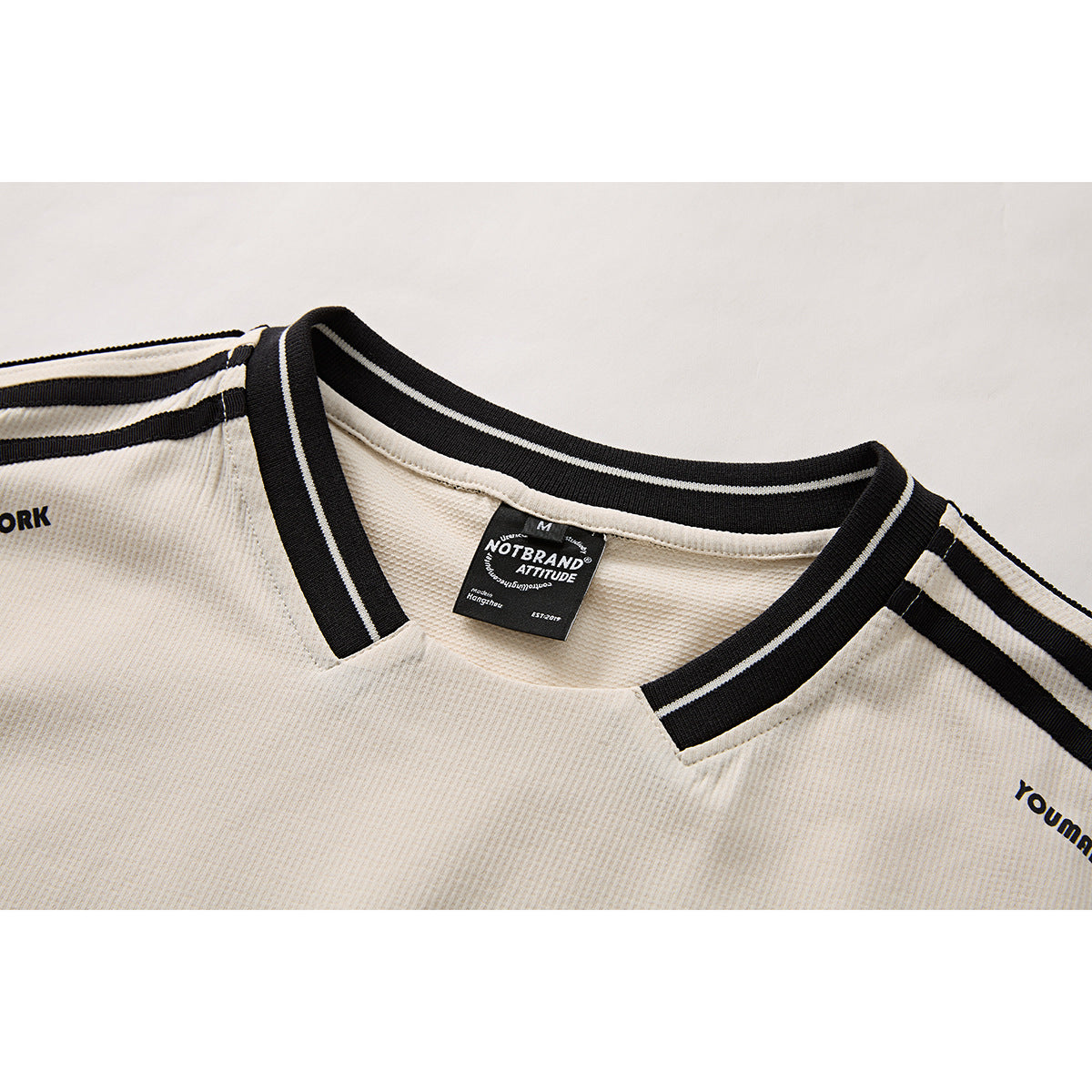Full-length view of oversized waffle knit V-neck T-shirt outfit