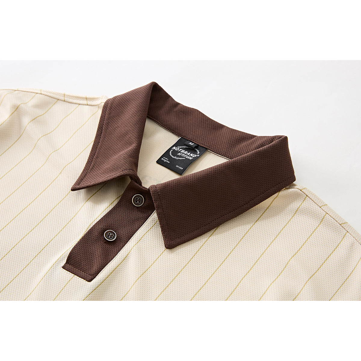 Fabric detail of striped oversized polo shirt