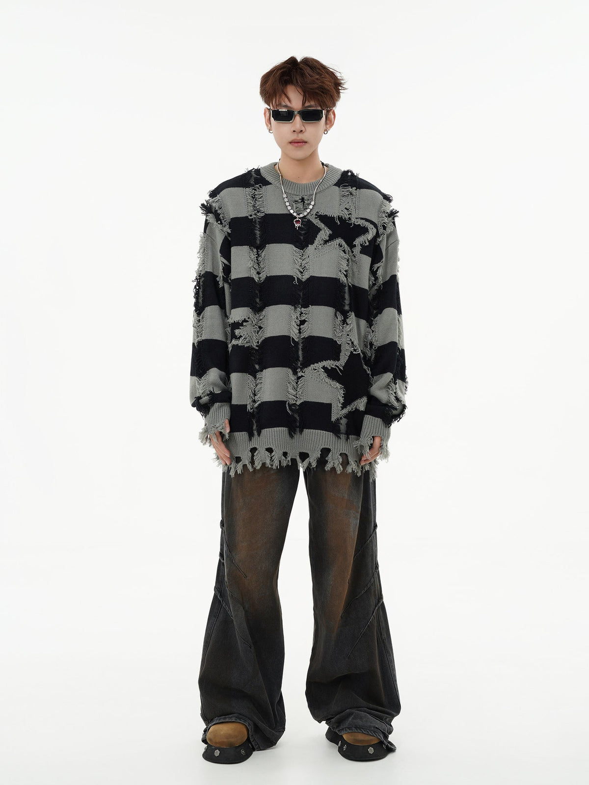 Side view of the oversized star stripe knit sweater