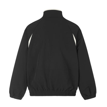 Black and white zip-up track jacket showing colourblock design