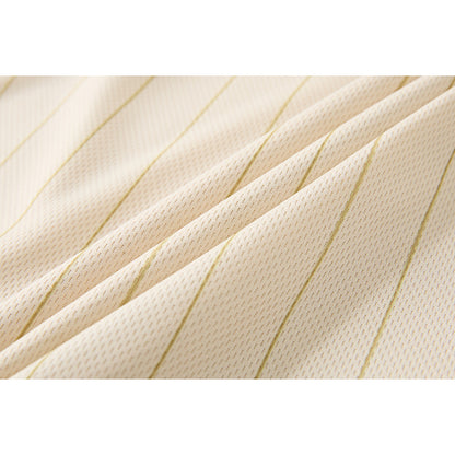 Angled view of oversized striped polo shirt with graphic detail
