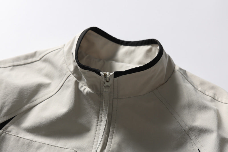 Close-up of the zip fastening on a black and white track jacket