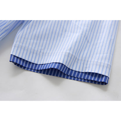 Full-length view of model wearing striped button-up shirt