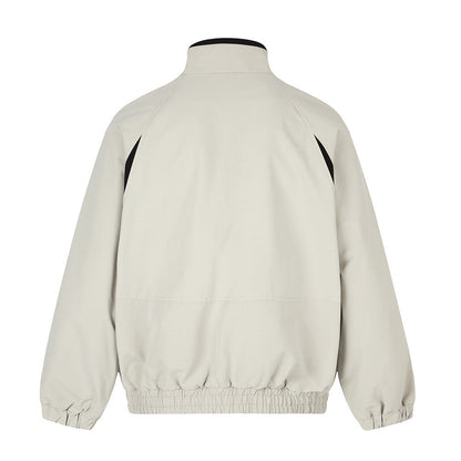 Black and white track jacket with long sleeves and stand collar