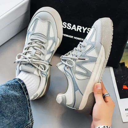 Pair of breathable board trainers viewed from above