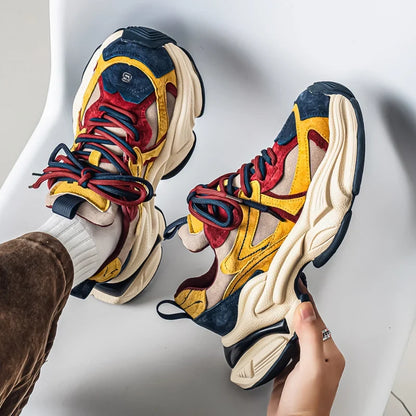 Pair of thick sole height increasing sneakers displayed together