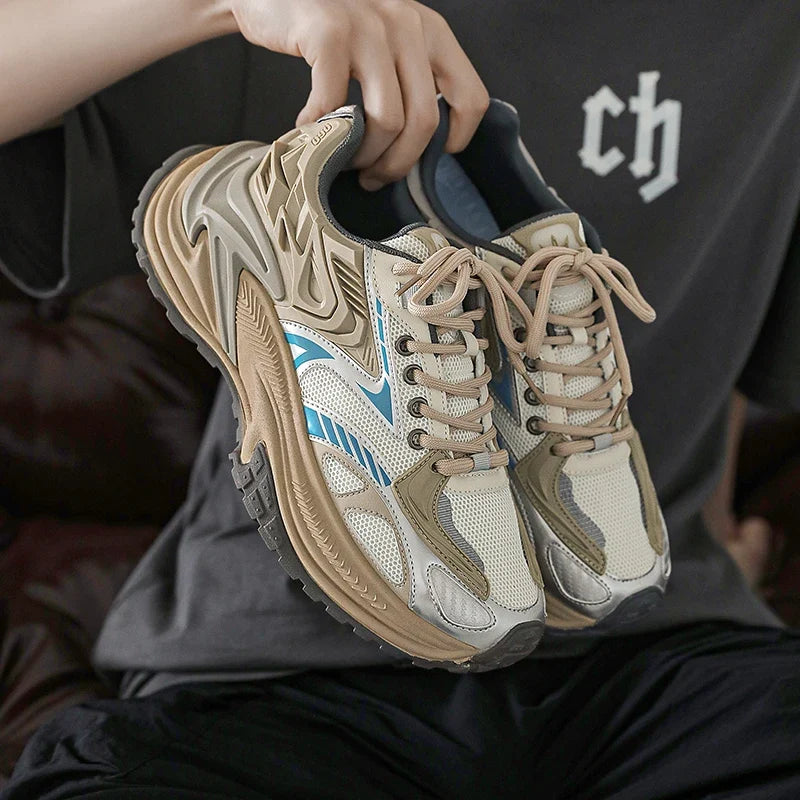 Chunky sports trainers shown at a three-quarter angle