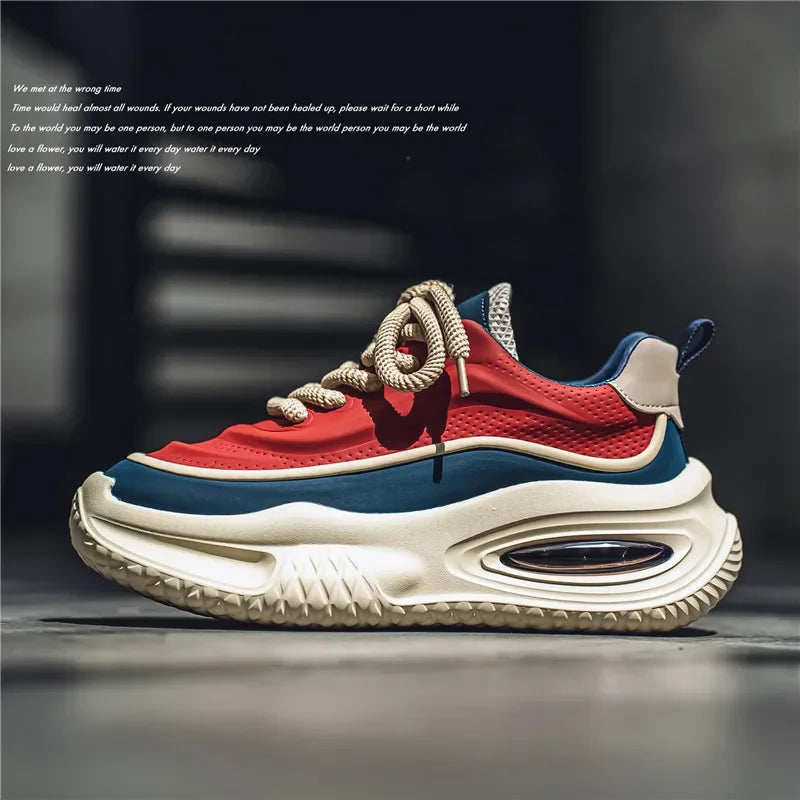 Air cushion trainers in red, black and beige, front view