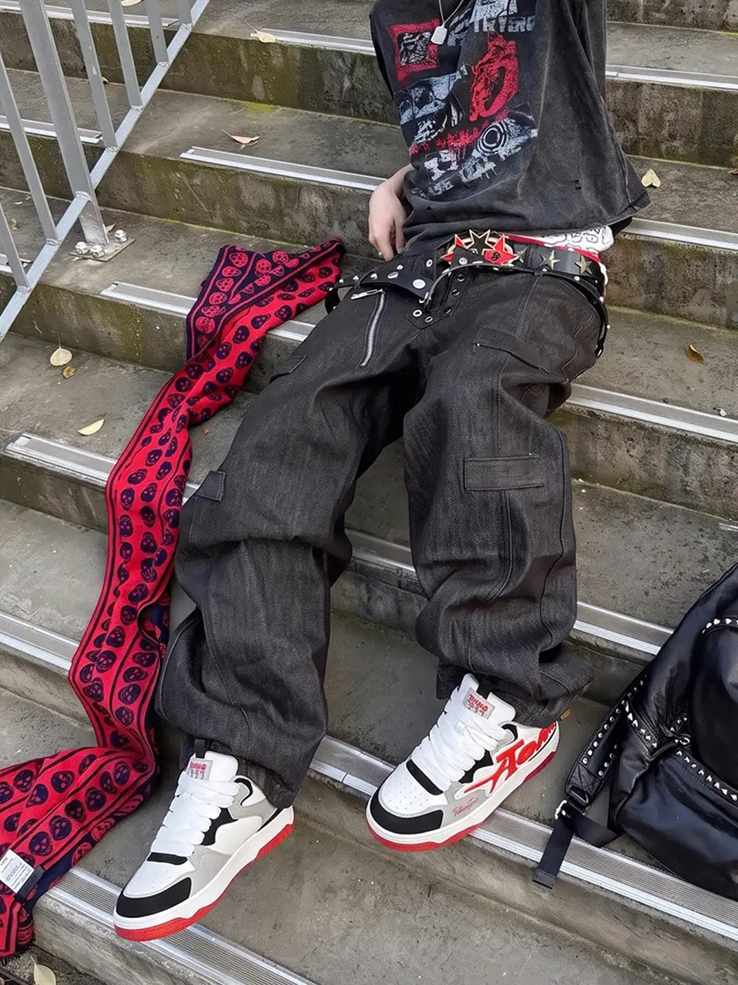 Oversized letter graphic sneaker pair displayed at a three-quarter angle