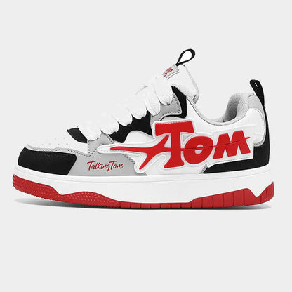 Pair of oversized letter graphic low-top sneakers shown from the side