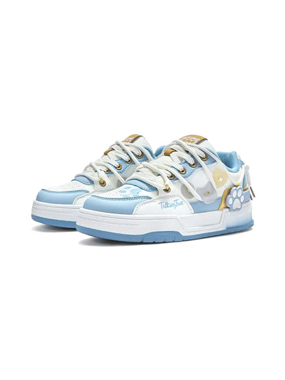 Pair of paw appliqué sneakers displayed at an angle