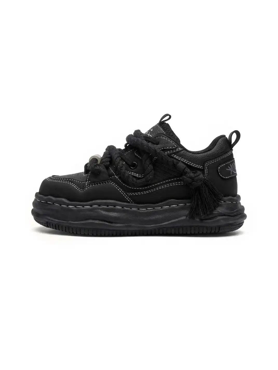 Rear view of chunky sneakers with a raised wavy sole