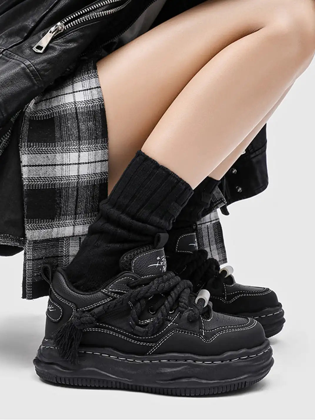 Close-up of the textured wavy sole on chunky sneakers