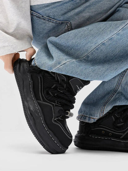 Chunky wavy sole sneakers shown from the front
