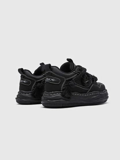 Pair of chunky wavy sole sneakers displayed together