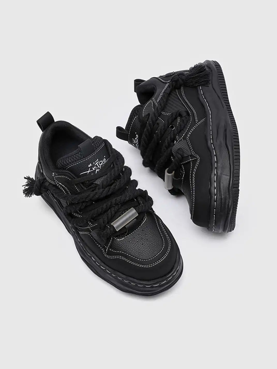 Detailed view of the upper on wavy sole sneakers