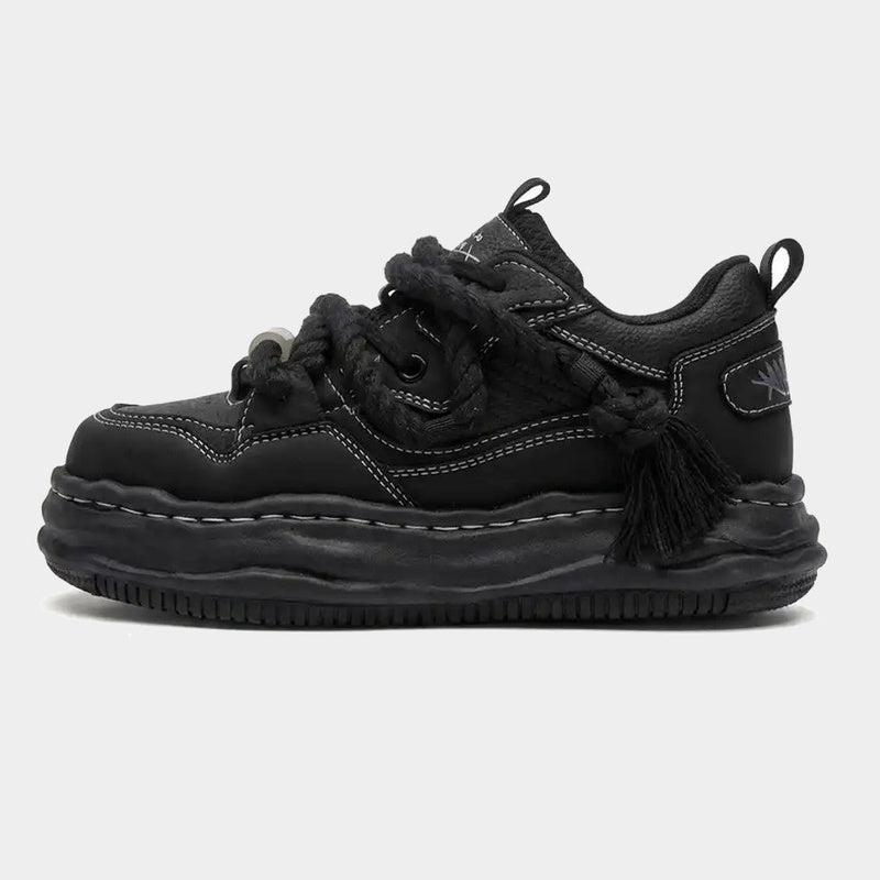 Chunky wavy sole sneakers shown from the side