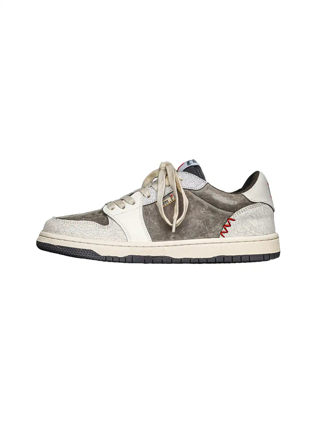 Worn finish and layered panels on low top trainers