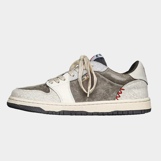 Worn suede panel low top trainers shown from the side