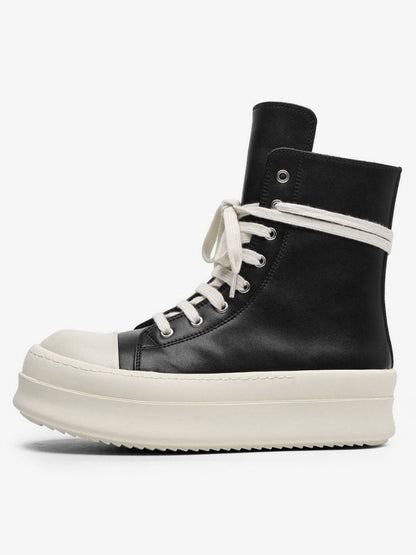 Platform high top sneakers showing the lace-up front and side fastening