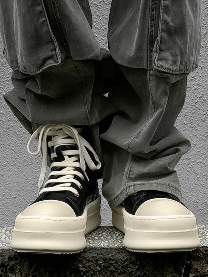 Side view of platform high top sneakers highlighting the ankle-high design