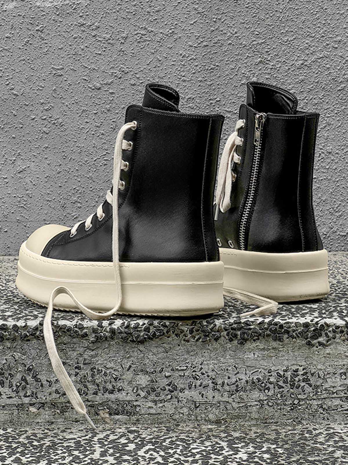 High top sneakers with platform soles shown in a casual styling view