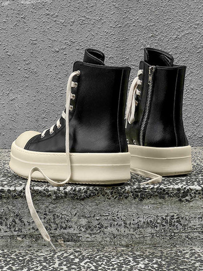 High top sneakers with platform soles shown in a casual styling view