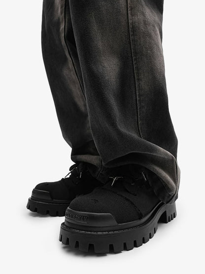 Chunky denim trainers showing the lace-up front and padded collar