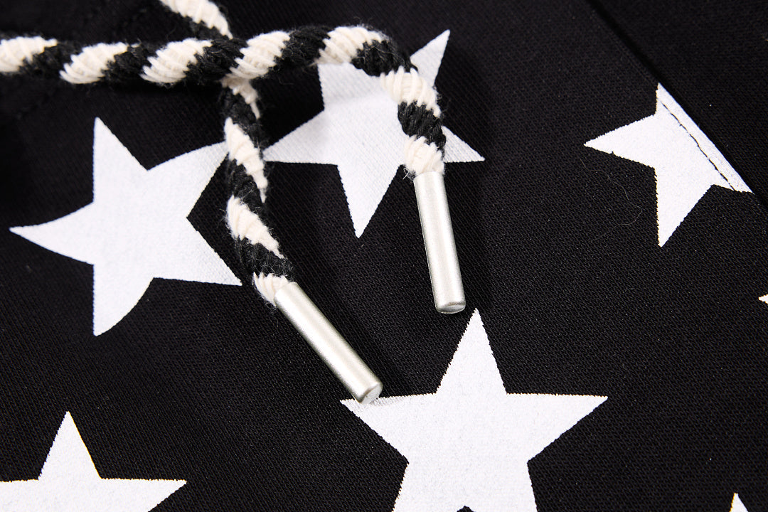 Close-up of the star print detail on the sweatpants
