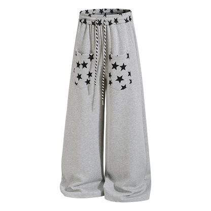 Full-length view of casual star print sweatpants
