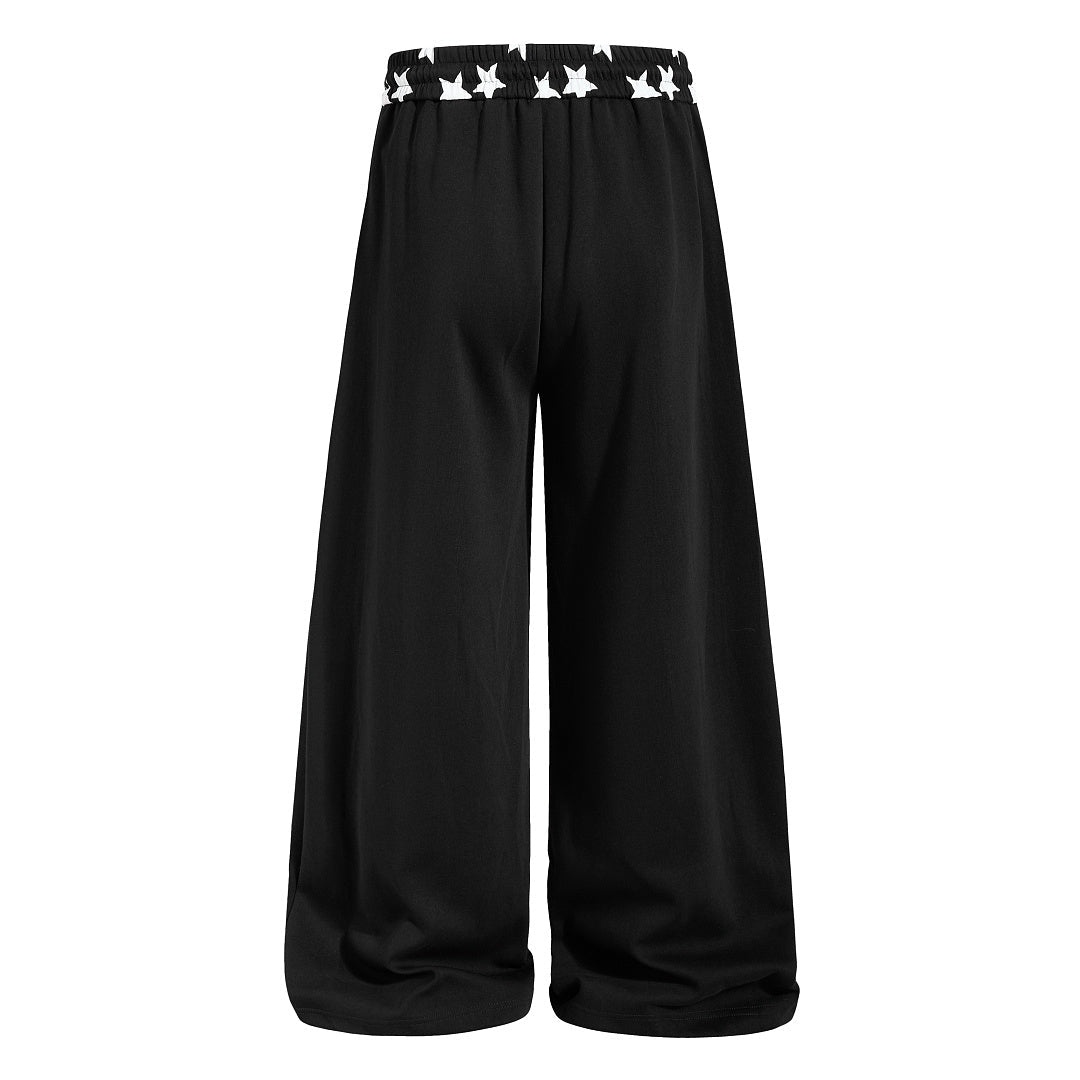 Star print sweatpants styled for a laid-back everyday outfit