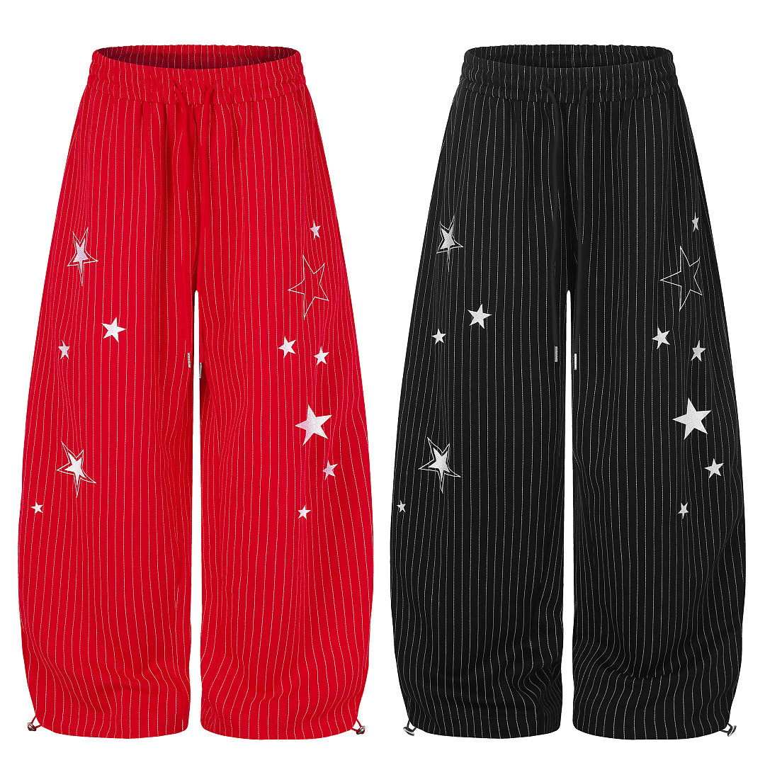 Side view showing the barrel-leg shape of the sweatpants