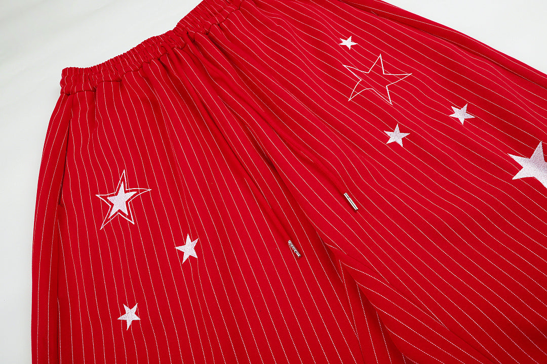 Star embroidered sweatpants presented in a casual streetwear look
