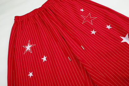 Star embroidered sweatpants presented in a casual streetwear look