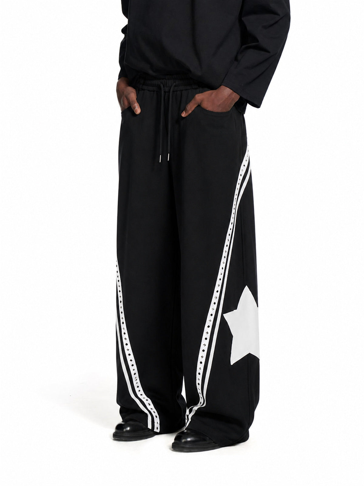 Baggy barrel sweatpants with curved panels shown from the front