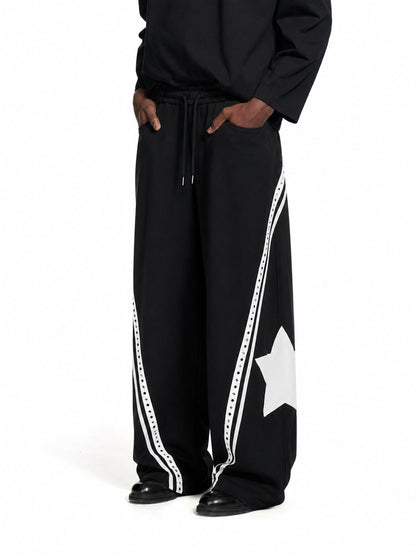 Baggy barrel sweatpants with curved panels shown from the front