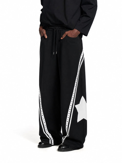 Baggy barrel sweatpants with curved panels shown from the front