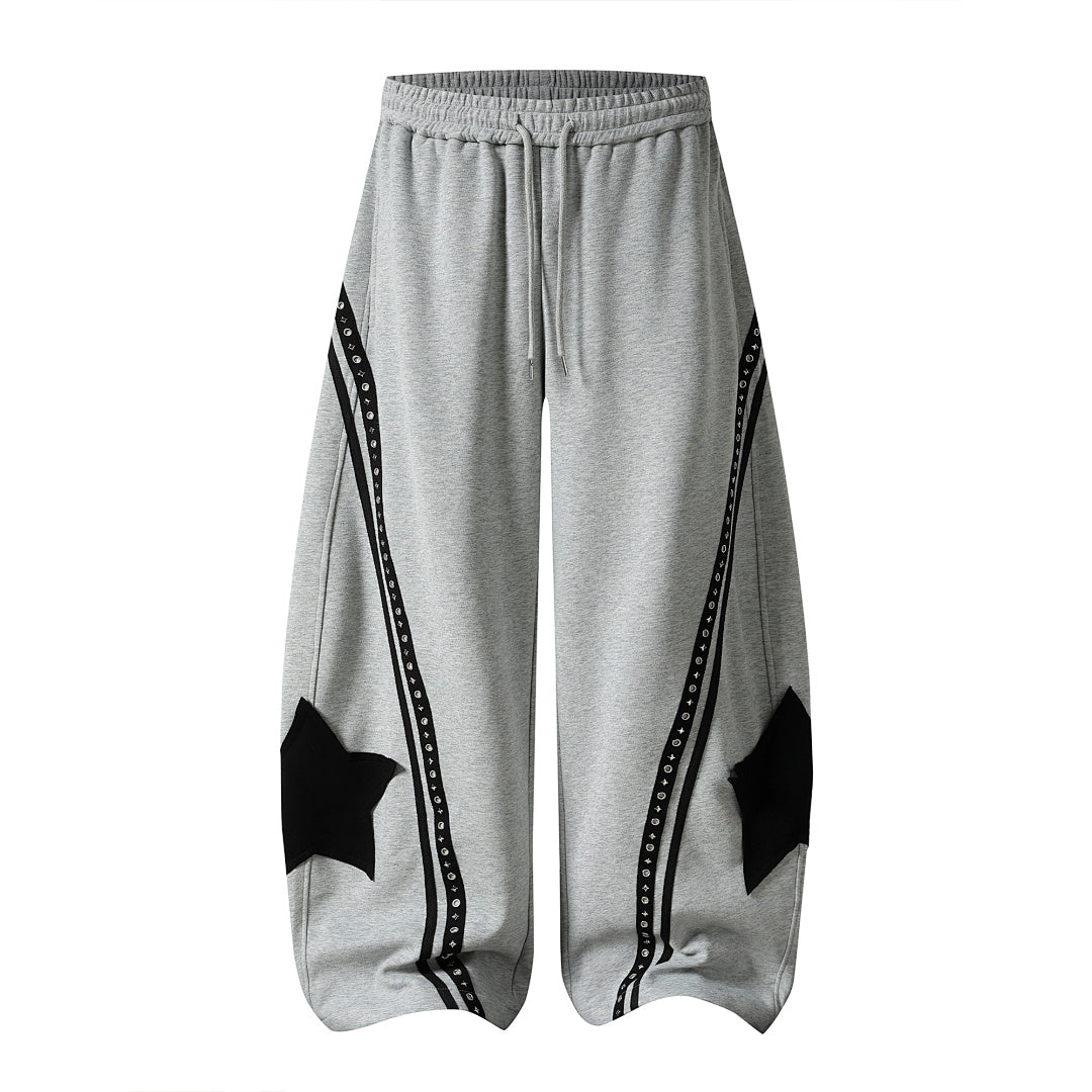 Side view highlighting the curved panels on the baggy sweatpants