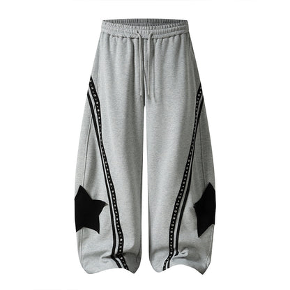 Side view highlighting the curved panels on the baggy sweatpants