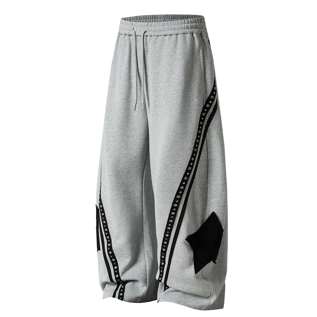 Close-up of the curved panel construction on the sweatpants
