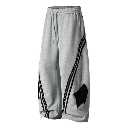 Close-up of the curved panel construction on the sweatpants