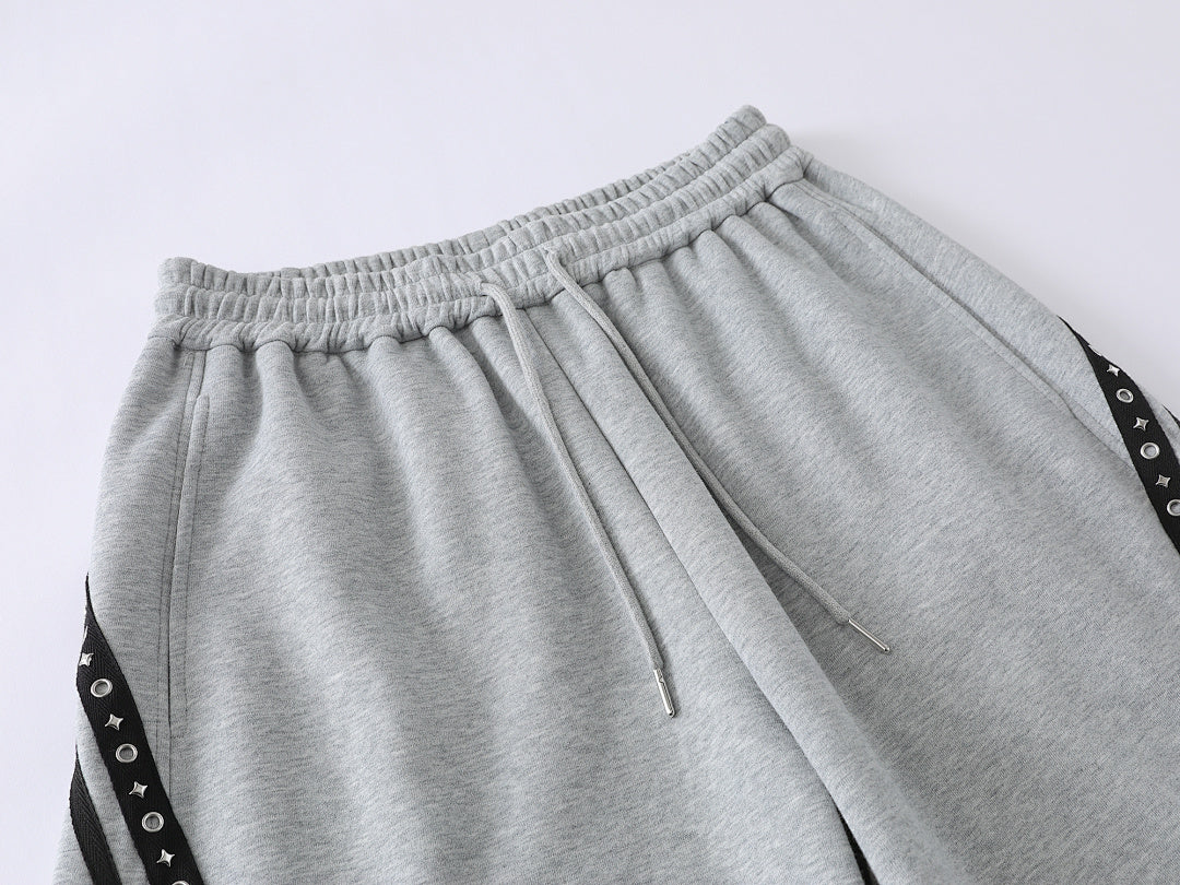 Full-length view of the relaxed trousers and curved leg shape