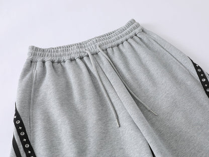 Full-length view of the relaxed trousers and curved leg shape
