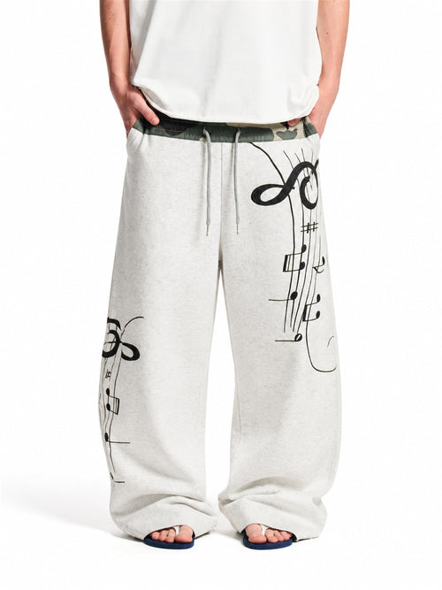 Camouflage baggy sweatpants with a relaxed barrel fit