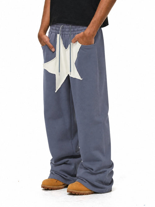 Oversized wide leg joggers with a large star appliqué detail